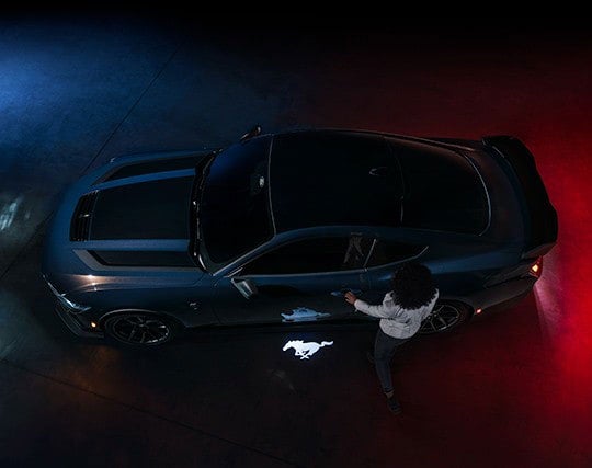 2024 Ford Mustang® Dark Horse™ model with a driver approaching the vehicle | Gates Ford Lincoln in Richmond KY