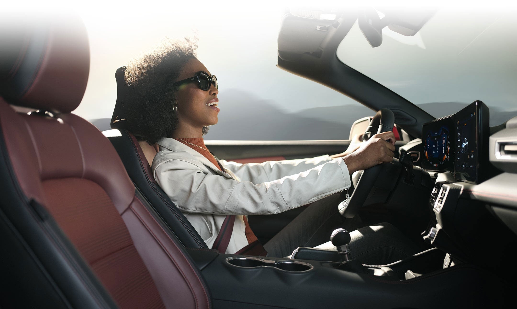 Person sitting in the driver’s seat of a 2024 Ford Mustang® convertible | Gates Ford Lincoln in Richmond KY