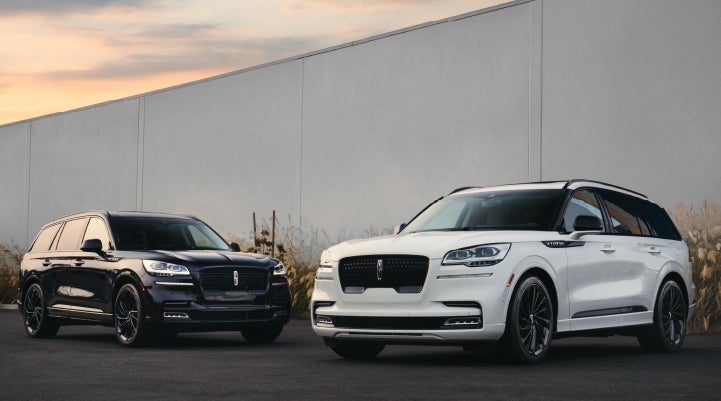 Two Lincoln Aviator® SUVs are shown with the available Jet Appearance Package | Gates Ford Lincoln in Richmond KY