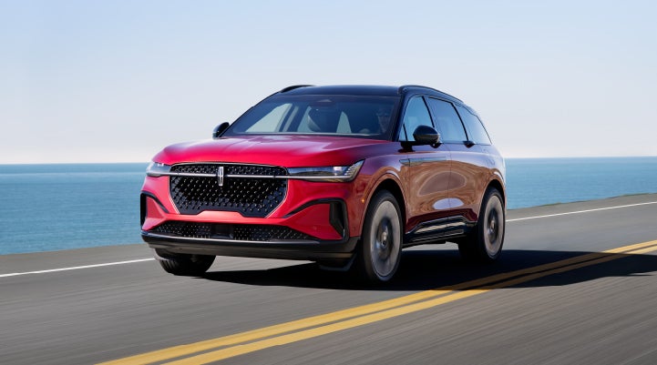 A 2024 Lincoln Nautilus® SUV is being driven on a seaside roadway. | Gates Ford Lincoln in Richmond KY