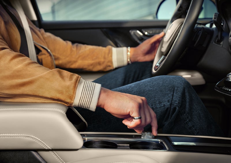 The driver of a 2026 Lincoln Corsair® SUV is shown selecting a drive mode. | Gates Ford Lincoln in Richmond KY