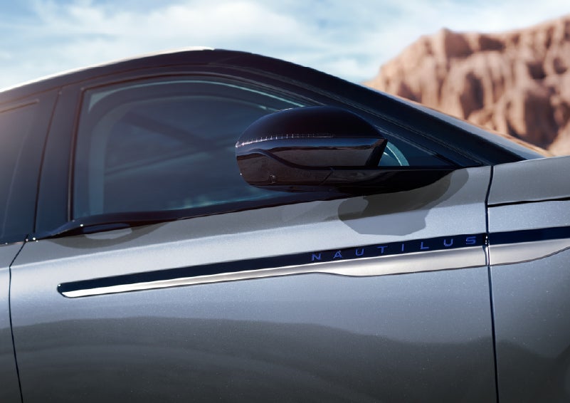 Blue lettering on the side of the vehicle that reads Nautilus indicates the available Hybrid Powertrain. | Gates Ford Lincoln in Richmond KY